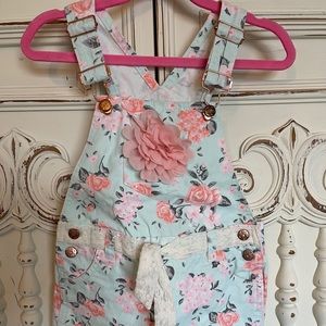 Girls floral overall shorts.
